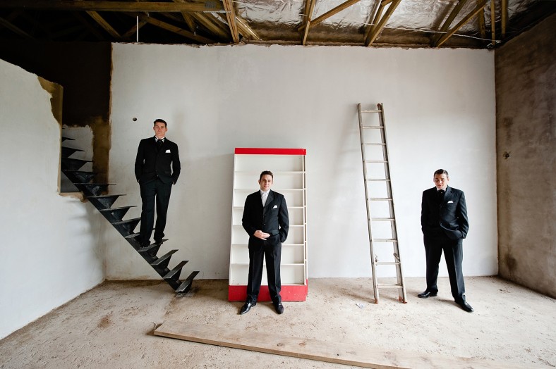 groom and groomsmen in construction site