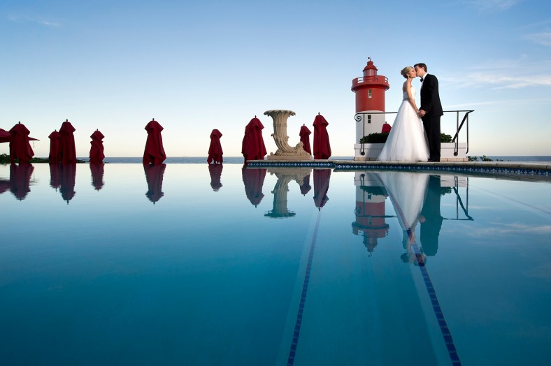 Bride and Groom on Infinity pool at the Oyster Box