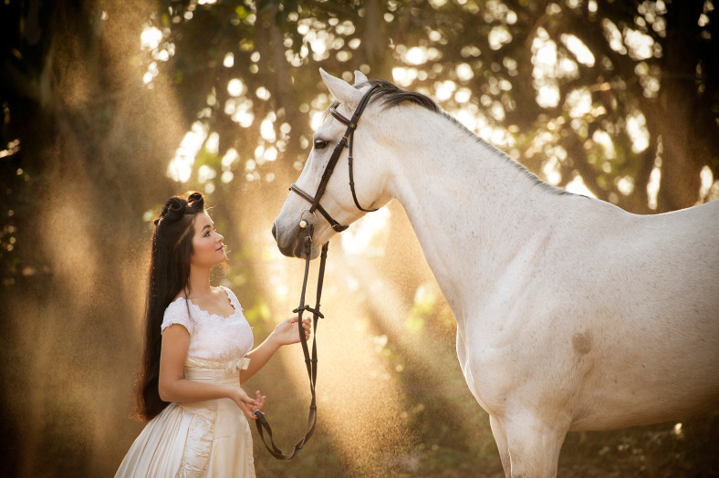 Girl with horse in amazing light