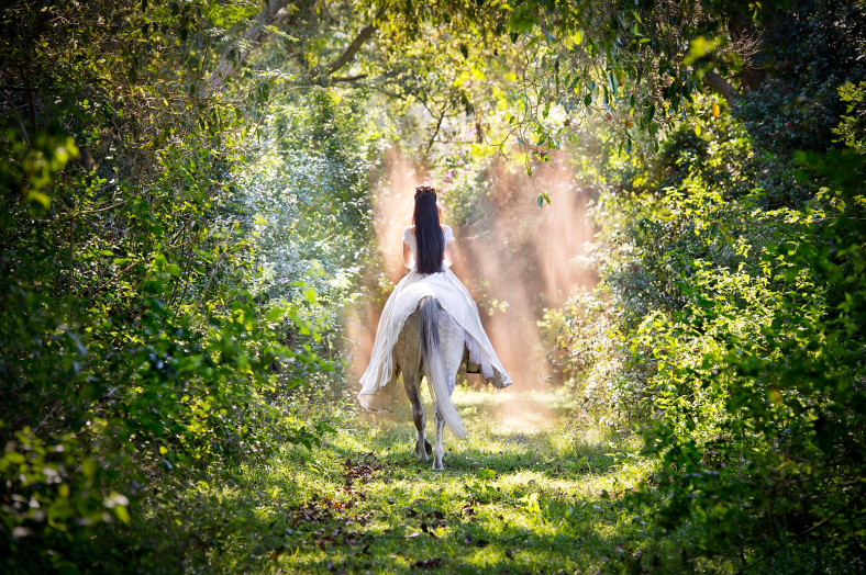 Girl riding away on a horse