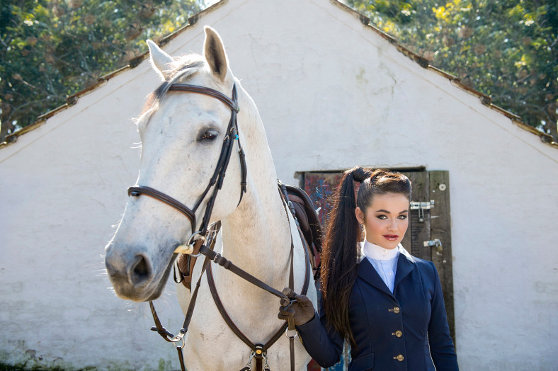 Girl with horse in riding gear