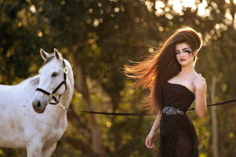 Girl with black Olivelli wedding dress and horse