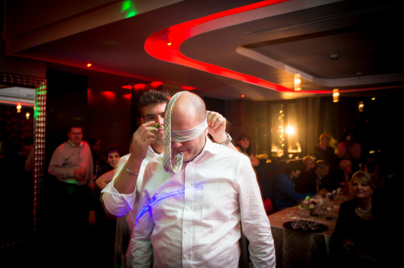 blindfolded groom with garter