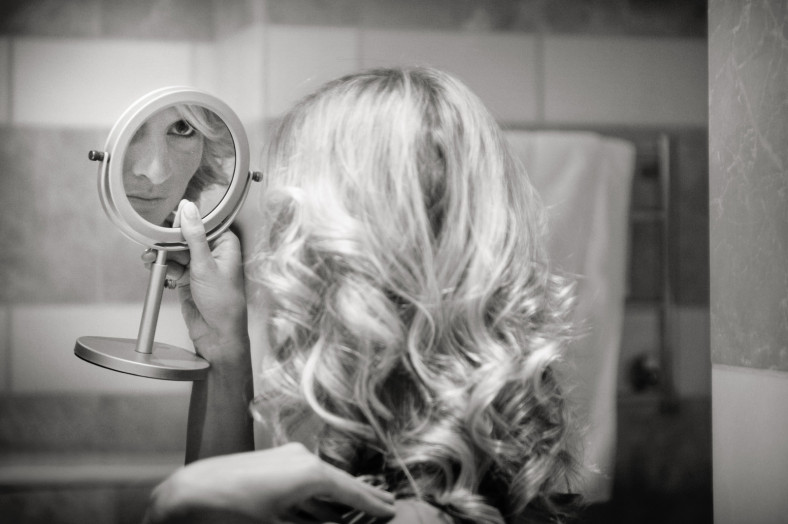 Bridesmaid looking in mirror Wedding at the Oyster Box Hotel Durban South Africa