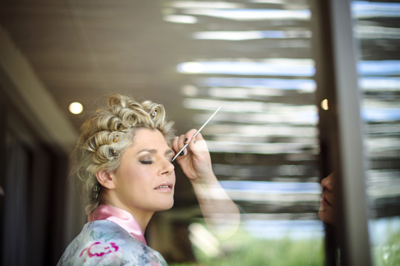 Bride getting her make up done