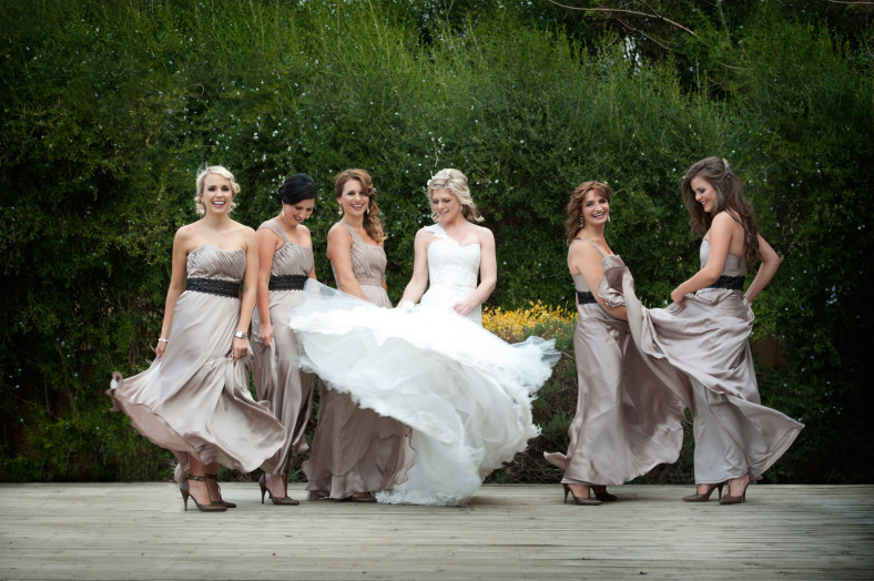 Bride and bridesmaids dancing