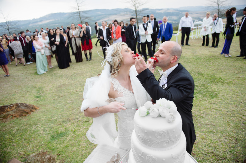 Bride and groom eating cake at Woodridge