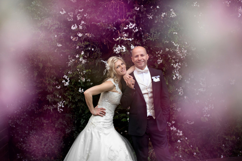 Bride and Groom with pink flowers