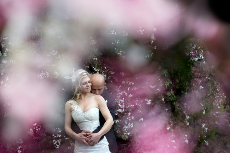Bride and Groom with pink flowers