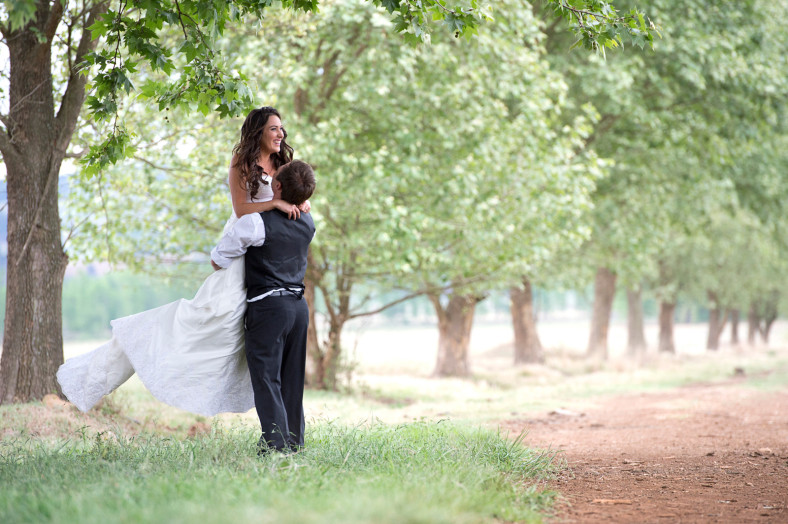 bride and groom in orchard