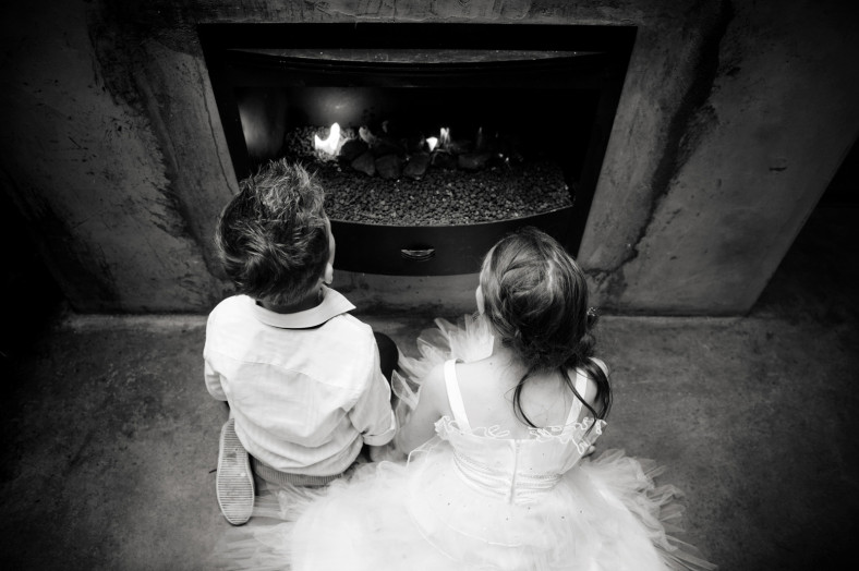 children by a fire place