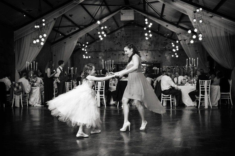 child dancing at a wedding