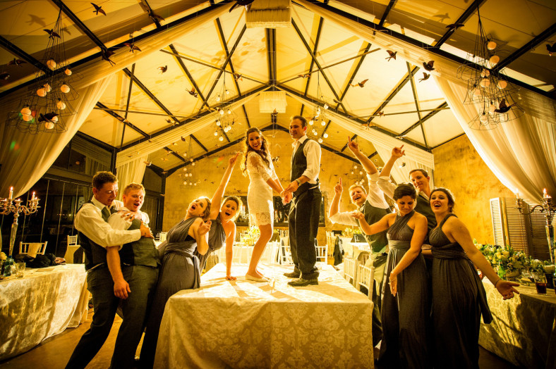 bride and groom dance on a table