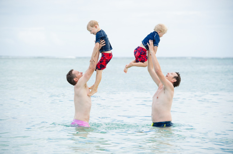 boys swimming in the ocean
