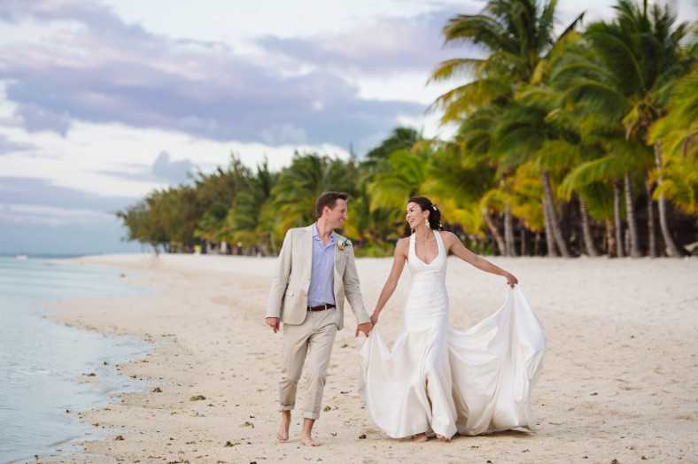 Bride and groom on La Morne beach St Regis