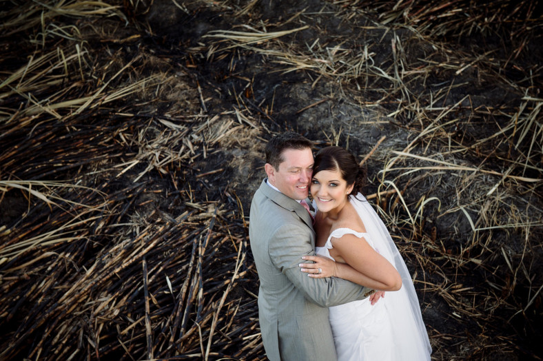 bride and groom in burnt grass