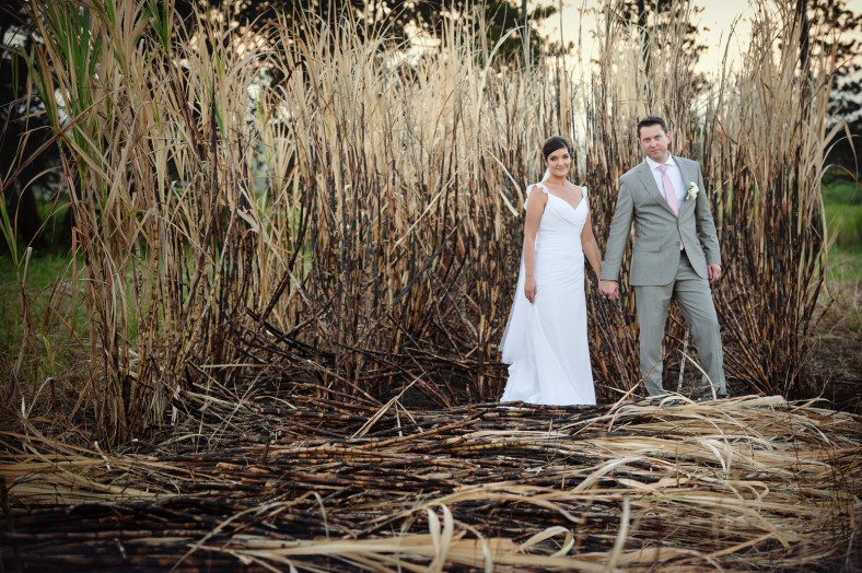 bride and groom in burnt grass