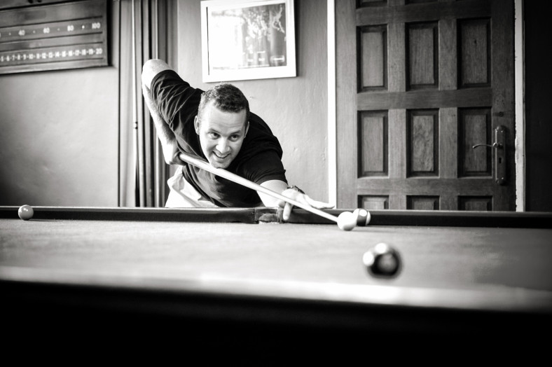 man playing pool
