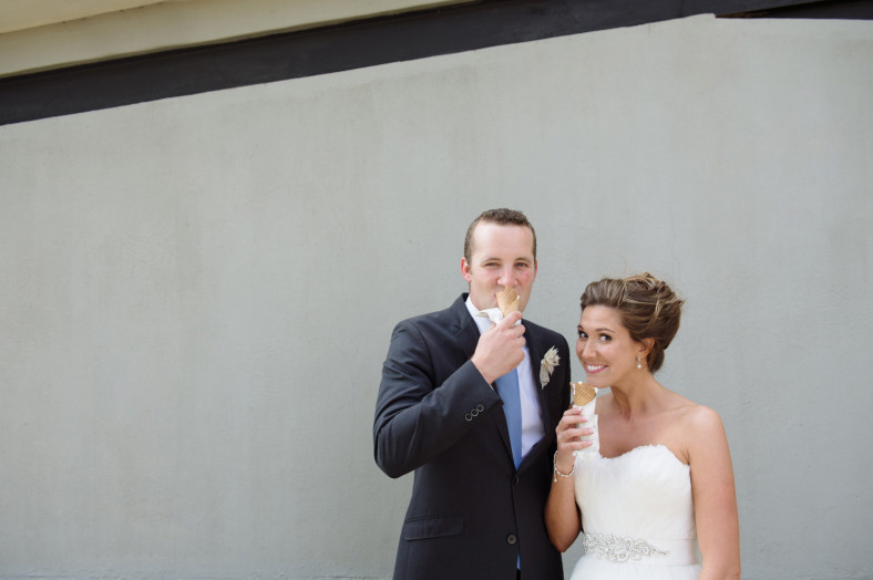 bride and groom eating ice cream