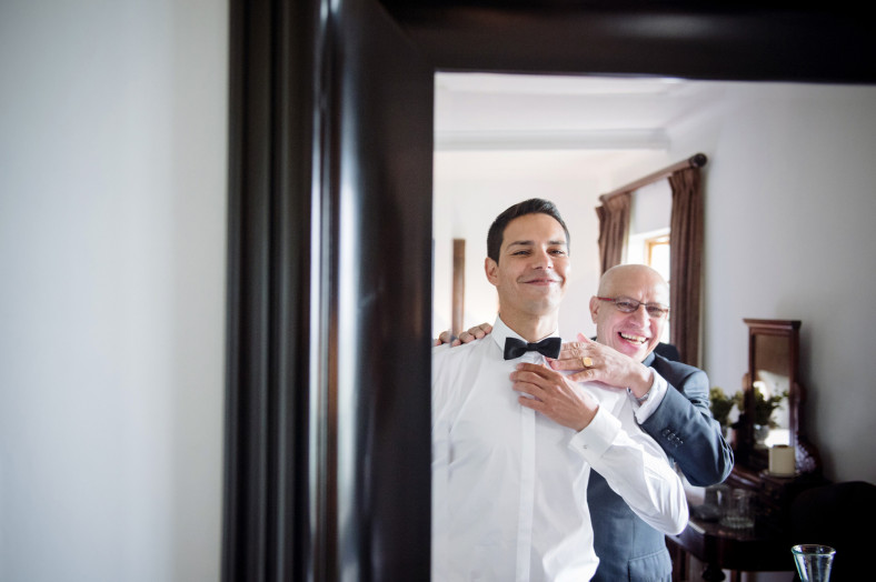 Father and son at a wedding