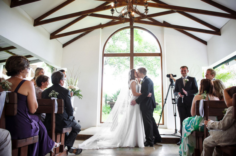 bride and groom first kiss