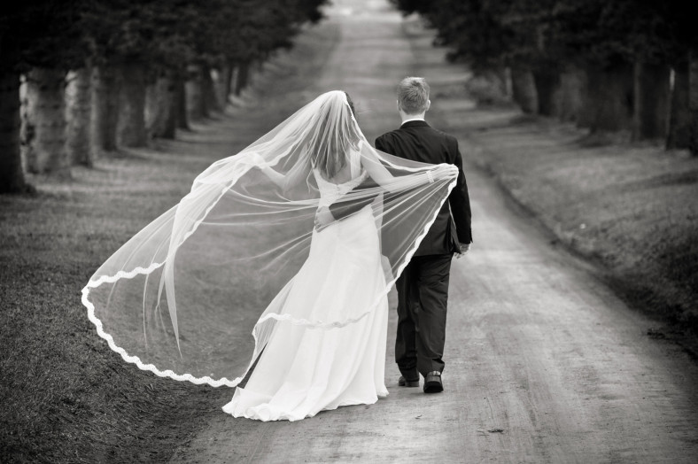 bride and groom with veil