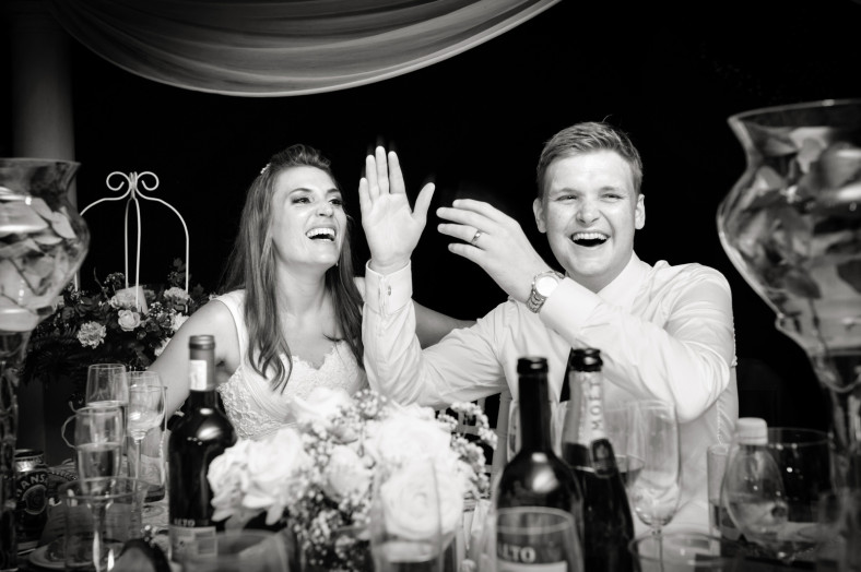laughing bride and groom