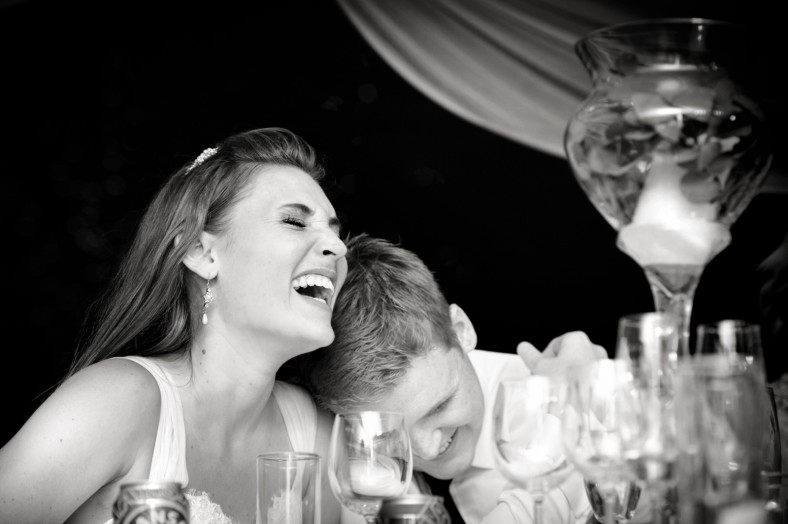 laughing bride and groom