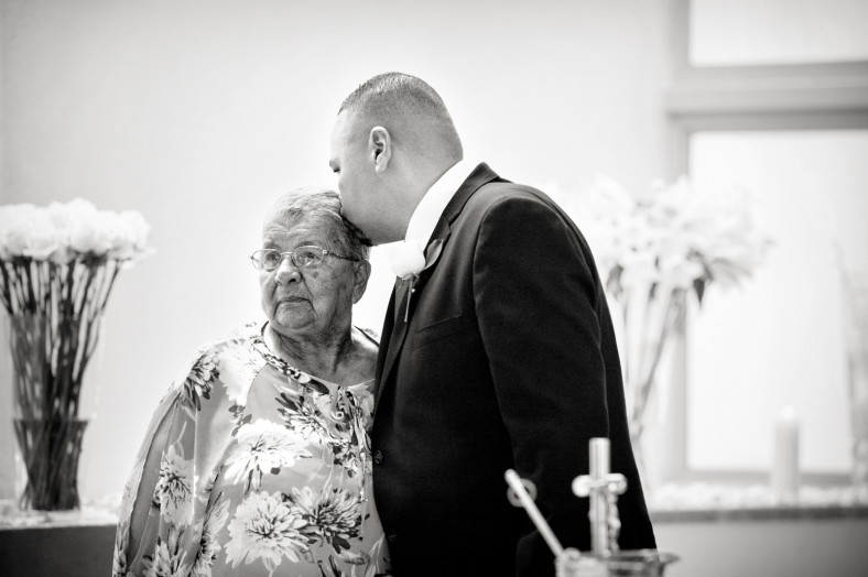 man kissing granny