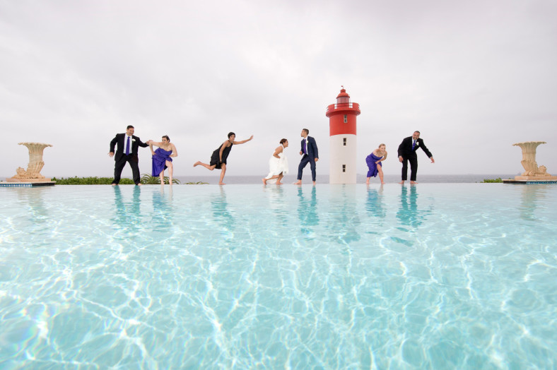 bridal party by swimming pool