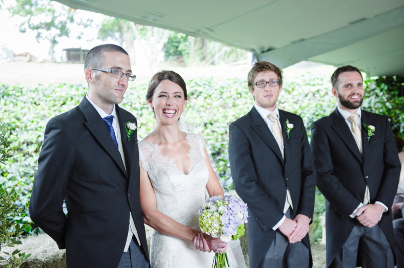 bride and goom at alter
