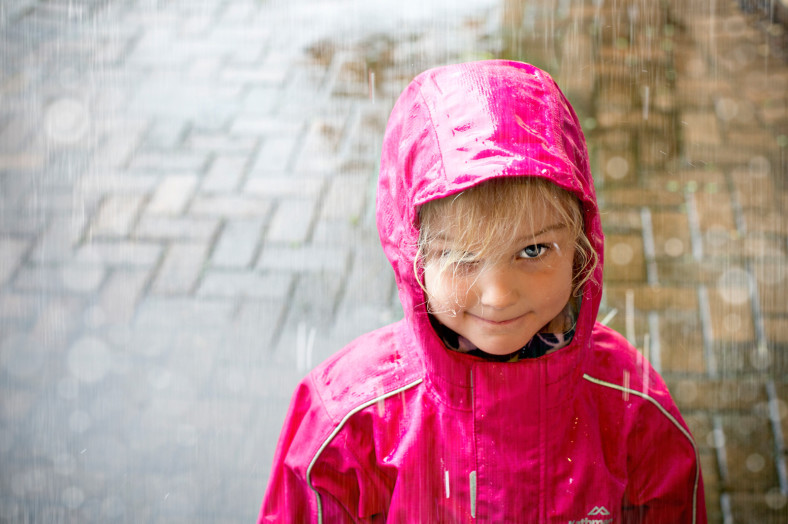 girl in pink rain coat