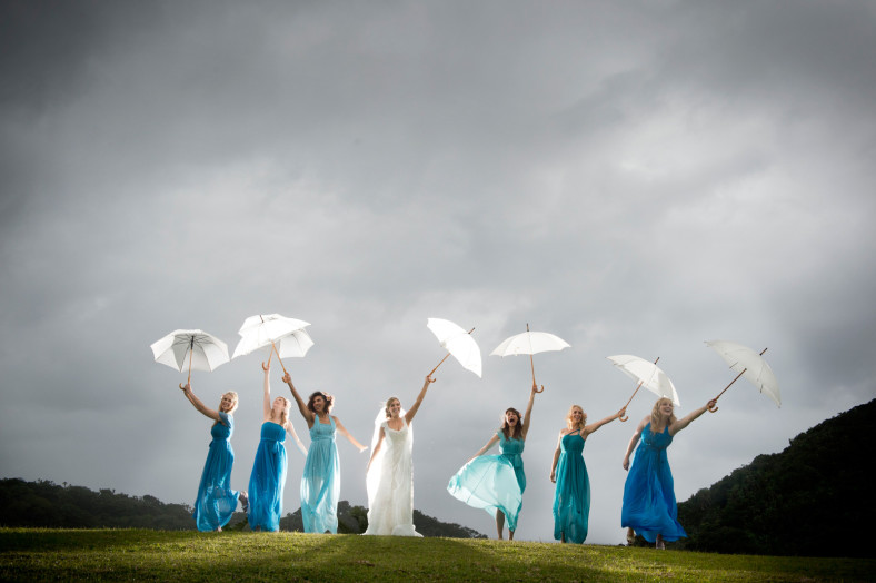 bride and bridesmaids in rain