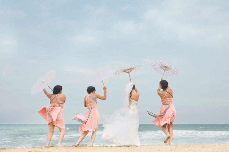 bride and bridesmaids blown away