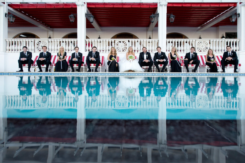 bridal party by a pool