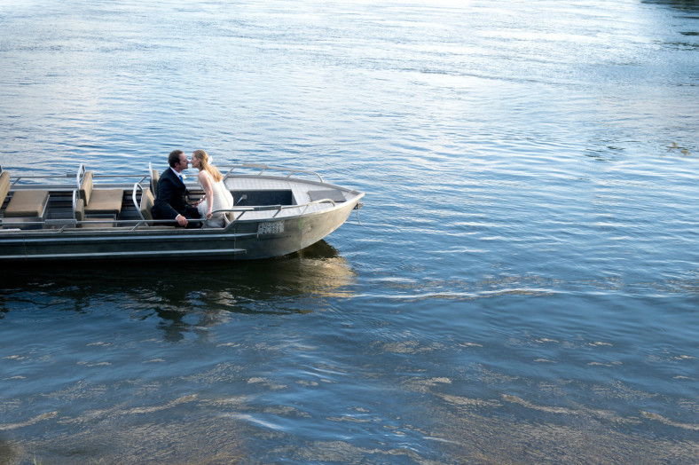bride and groom in boat