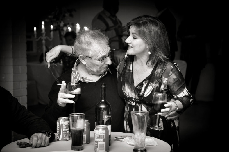 grandfather looking at woman's chest