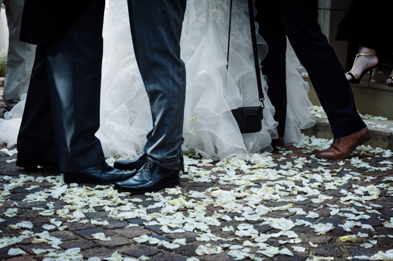 Bride and Groom congratulations with rose petal confetti