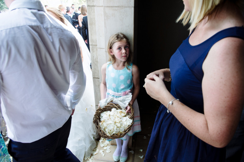 Flower girl with rose petals