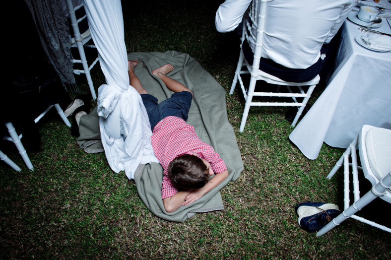 child sleeping at wedding
