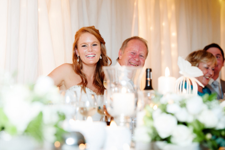 Bride laughing at speeches