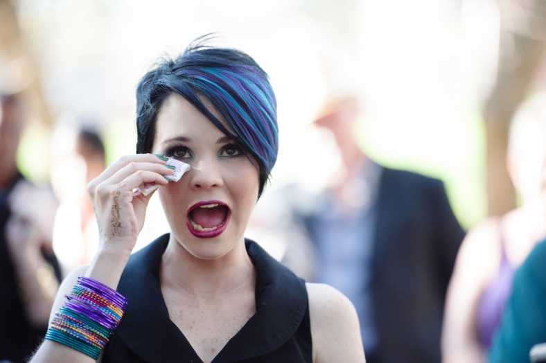 bride in black dress crying