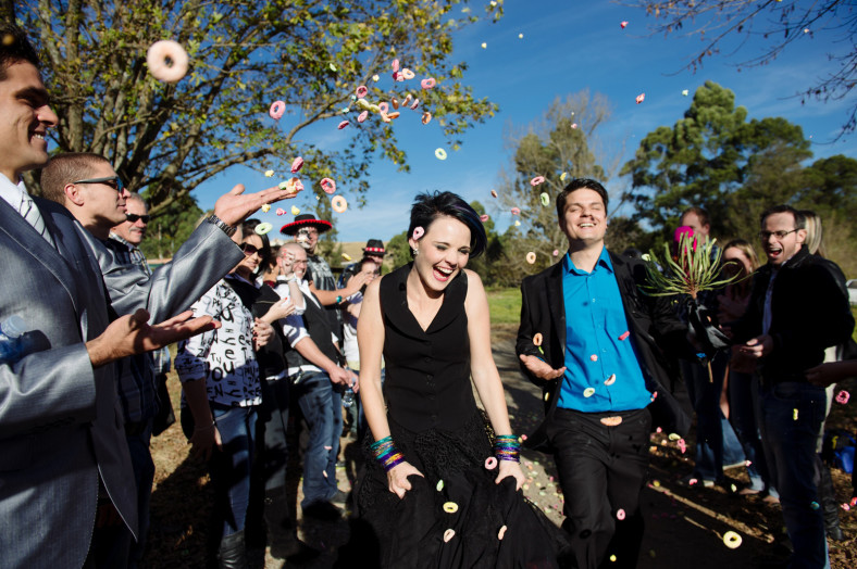 bride in black dress confetti