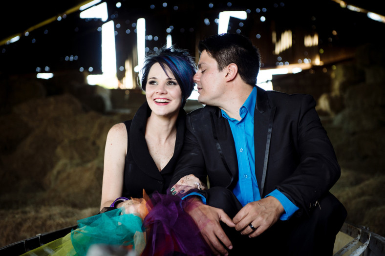bride and groom in a barn