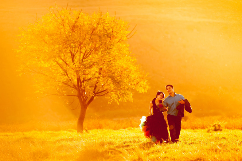 bride and groom in a field