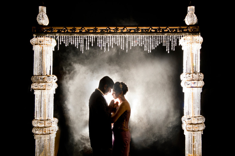 Hindu couple under crystal arch