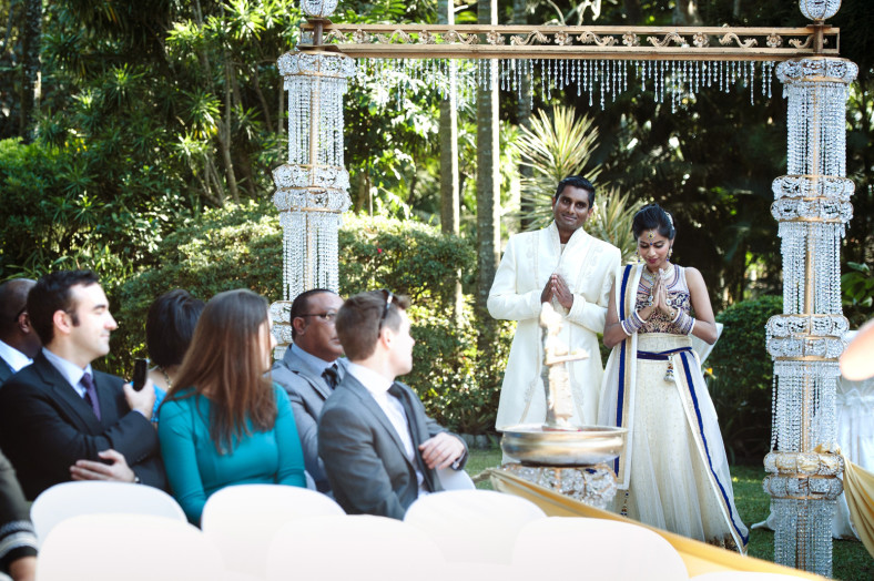 indian couple walking down aisle