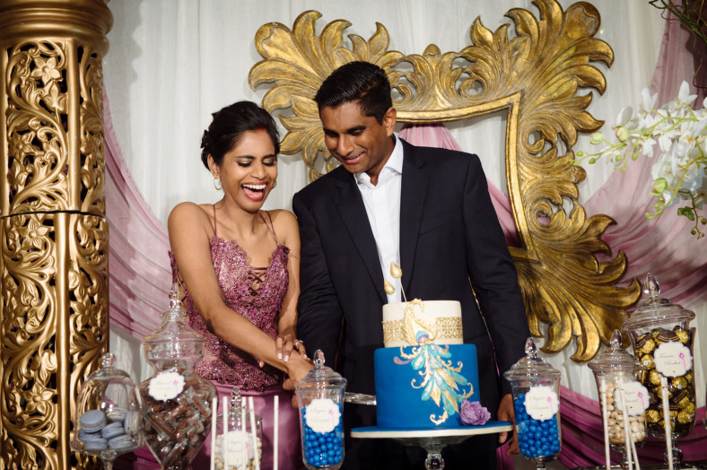 bride and groom cutting cake