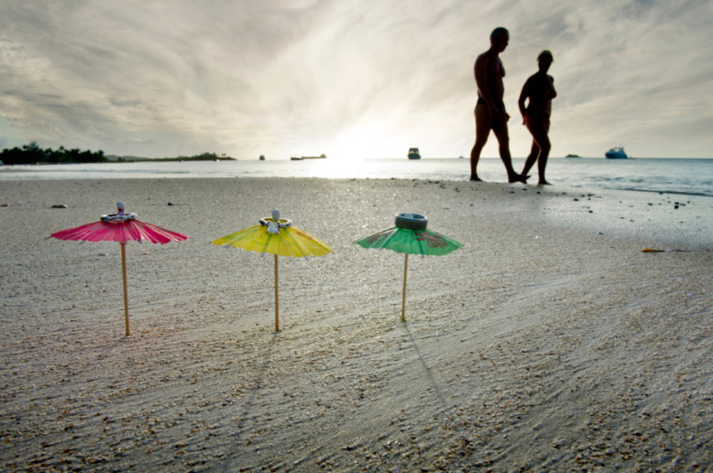 Wedding rings on a beach unbrella