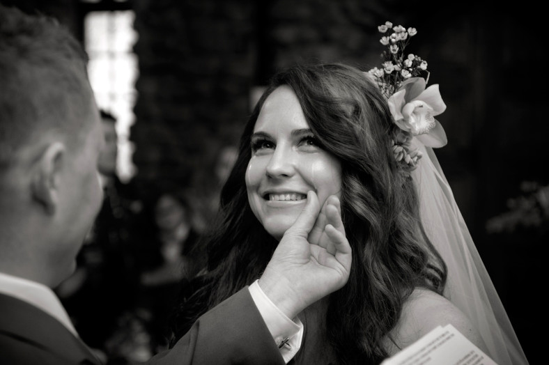groom wiping brides tears